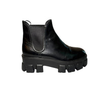 Prada Black leather monolith boot with chunky sole right outside view of right shoe on a white background