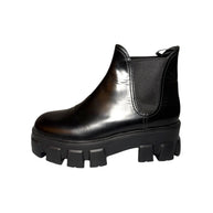 Prada Black leather left chelsea boot with chunky sole on a white background