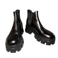 Pair of Prada Monolith black platform boots on a white background Main Photo