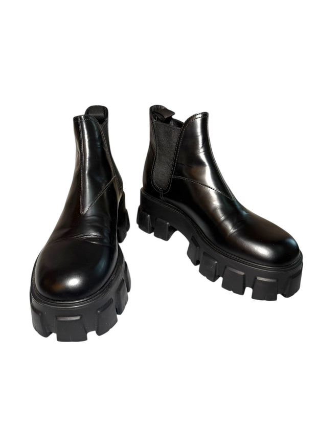 Pair of Prada Monolith black platform boots on a white background Main Photo