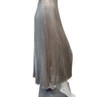 Profile view of Prada metallic pleated skirt highlighting fluid pleats, mid-calf length, and elegant drape.