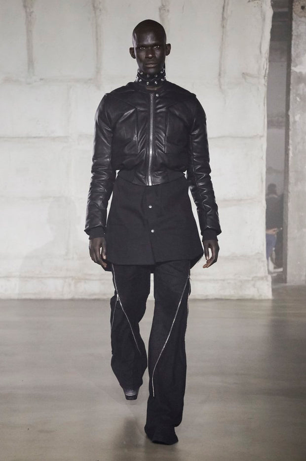 Man wearing a black bomber jacket on the runway for the Rick Owens FW22 Strobe Collection Fashion show in Paris France showcasing the style of the jacket in the listing.