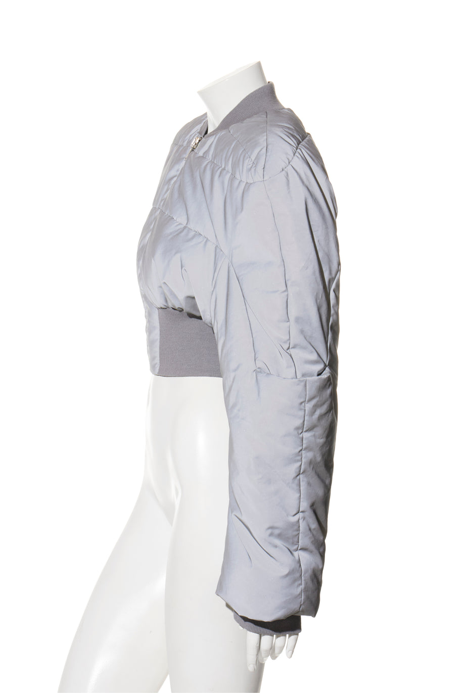 Rick Owens Light gray quilted puffer bomber jacket on a white mannequin against a white background left side view