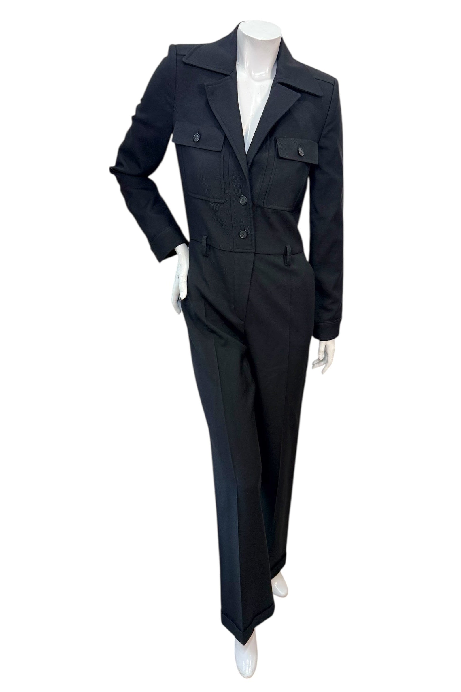 Front view of Saint Laurent Paris black wool tailored jumpsuit from Fall Winter 2022 featuring blazer-style lapels and straight-leg trousers.