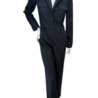 Front view of Saint Laurent Paris black wool tailored jumpsuit from Fall Winter 2022 featuring blazer-style lapels and straight-leg trousers.