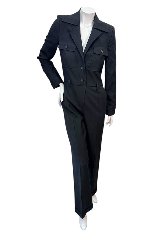 Front view of Saint Laurent Paris black wool tailored jumpsuit from Fall Winter 2022 featuring blazer-style lapels and straight-leg trousers.