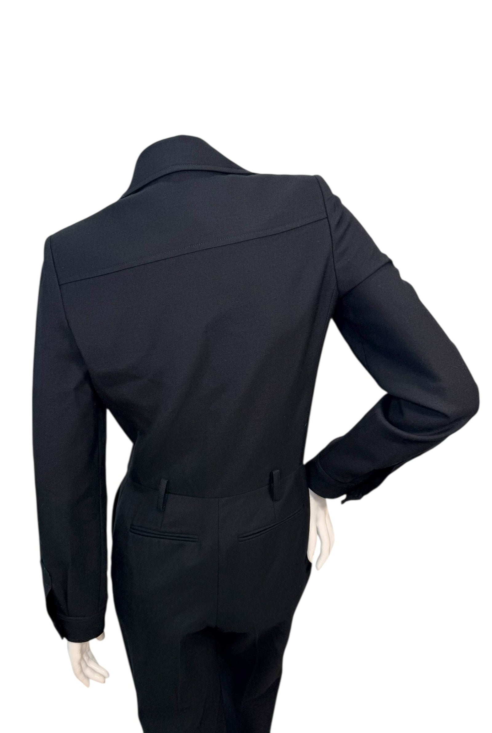 Back waist detail of Saint Laurent tailored jumpsuit showing clean construction and fitted silhouette.