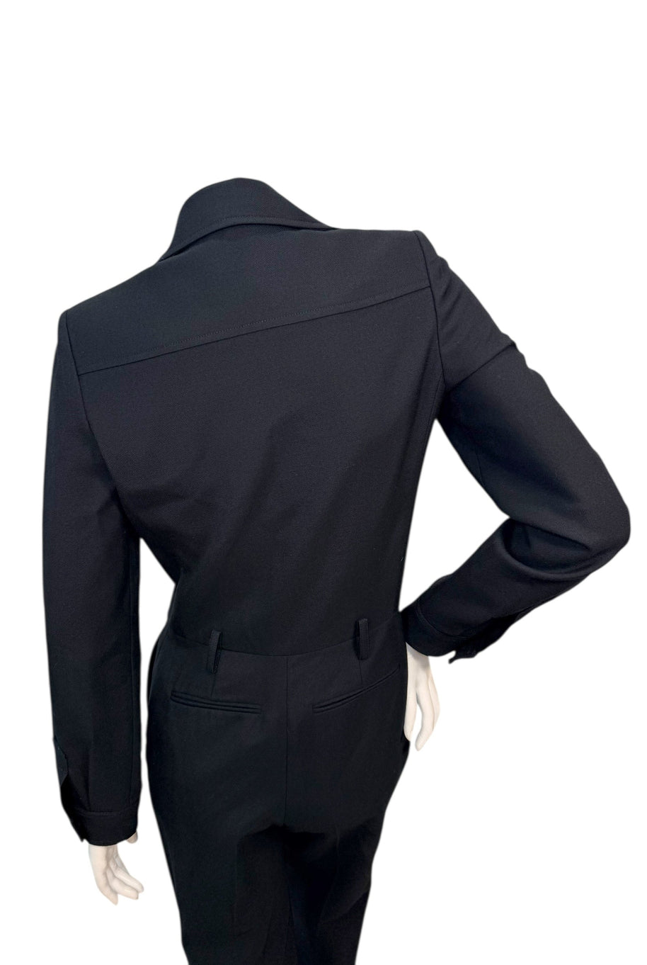 Back waist detail of Saint Laurent tailored jumpsuit showing clean construction and fitted silhouette.