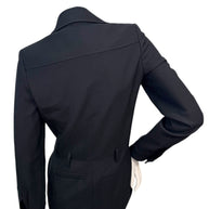 Back waist detail of Saint Laurent tailored jumpsuit showing clean construction and fitted silhouette.