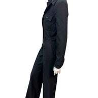Side profile of Saint Laurent FW22 black wool jumpsuit highlighting tailored blazer construction and straight-leg fit.