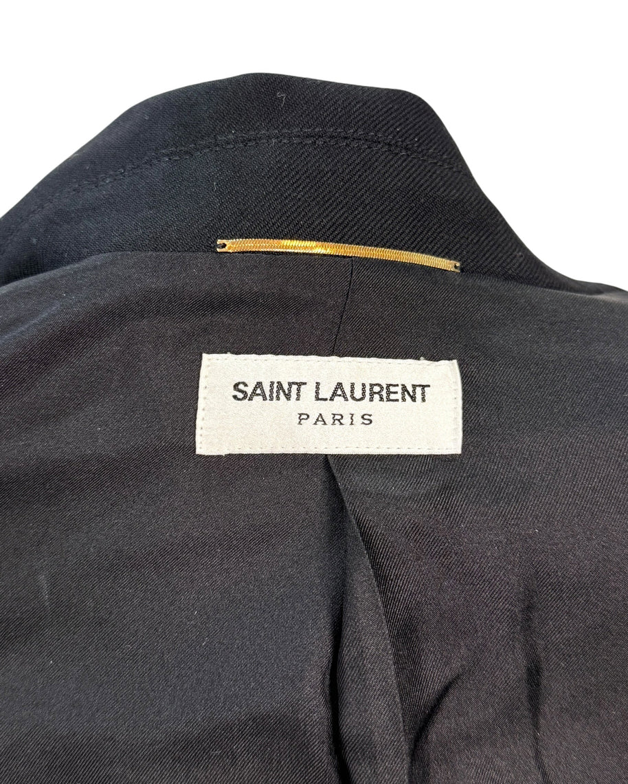 Interior neck label of Saint Laurent Paris black wool jumpsuit confirming designer authenticity.