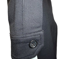 Sleeve cuff detail of Saint Laurent Paris black wool jumpsuit with signature branded button.