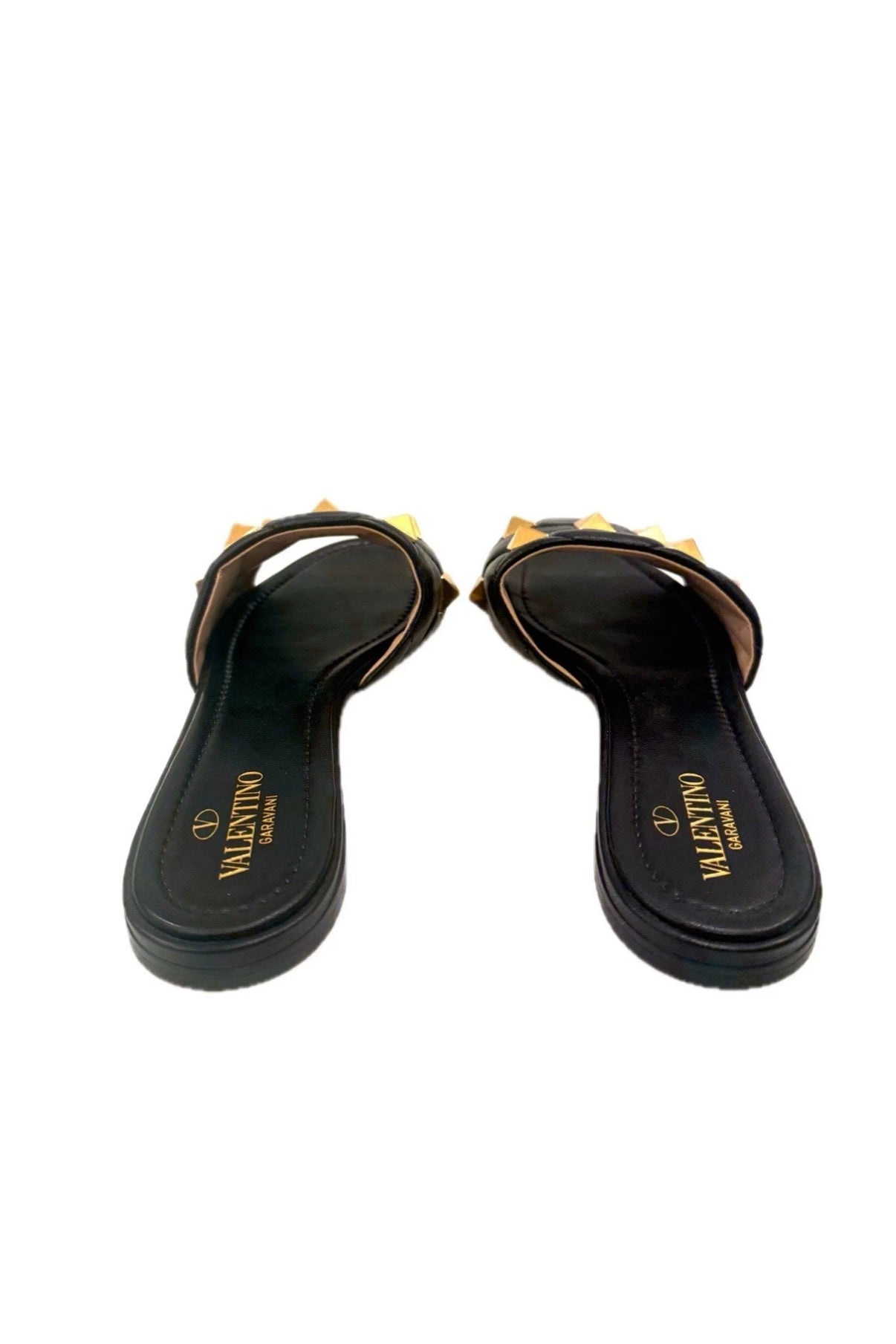 Close-up of Valentino Garavani Roman Stud Slides sole with size 39 and Made in Italy imprint.