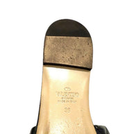 Sole view of Valentino Roman Stud Slides showing wear consistent with light use.