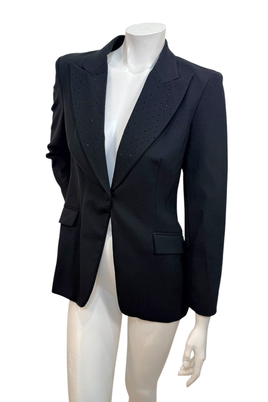 Angled front view of vintage Moschino Jeans black blazer with structured tailoring and studded lapels