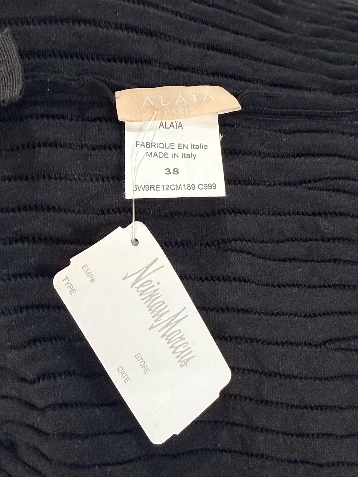 Alaïa black ribbed knit dress interior Alaïa brand label