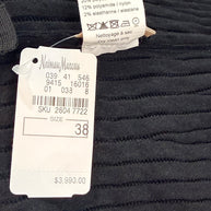 Alaïa black ribbed knit dress interior composition and care label