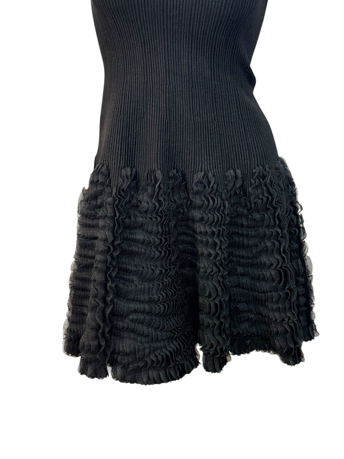 Alaïa black ribbed knit dress sculptural ruffle skirt close-up detail