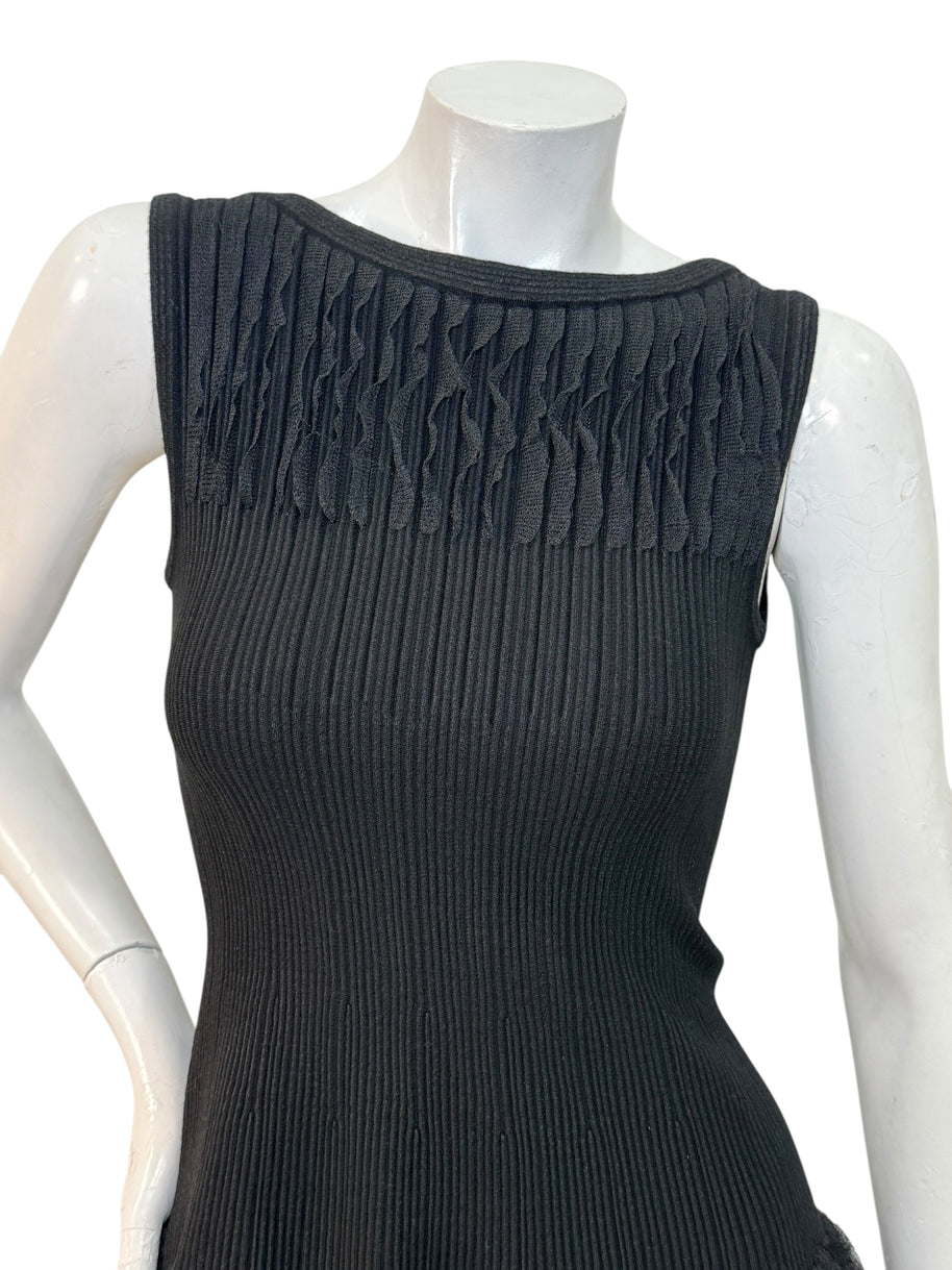 Alaïa black ribbed knit dress sculptural ruffle skirt detail