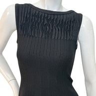 Alaïa black ribbed knit dress sculptural ruffle skirt detail