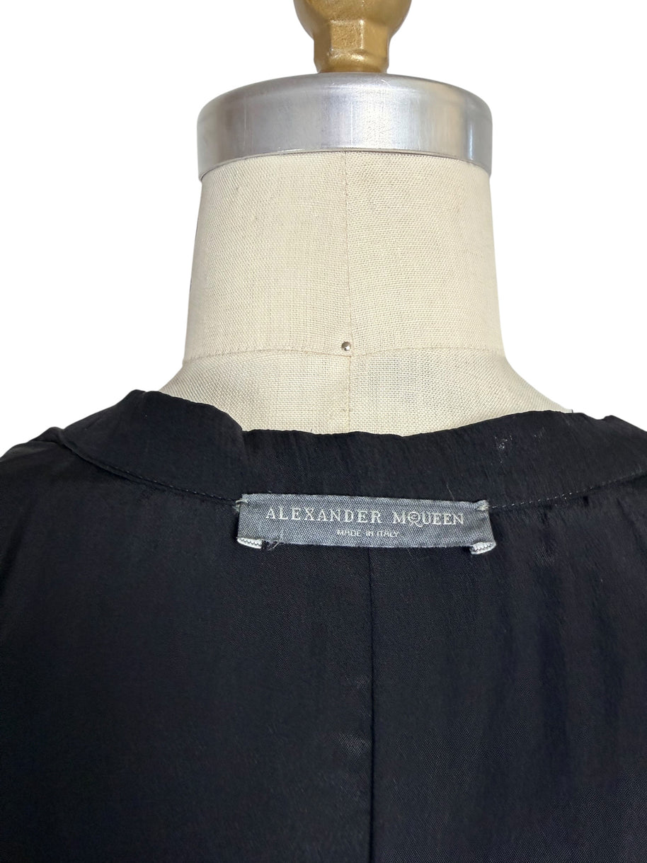 Close-up photograph of the original Alexander McQueen Made in Italy woven neck label.