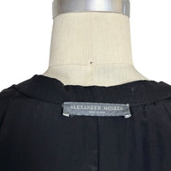 Close-up photograph of the original Alexander McQueen Made in Italy woven neck label.
