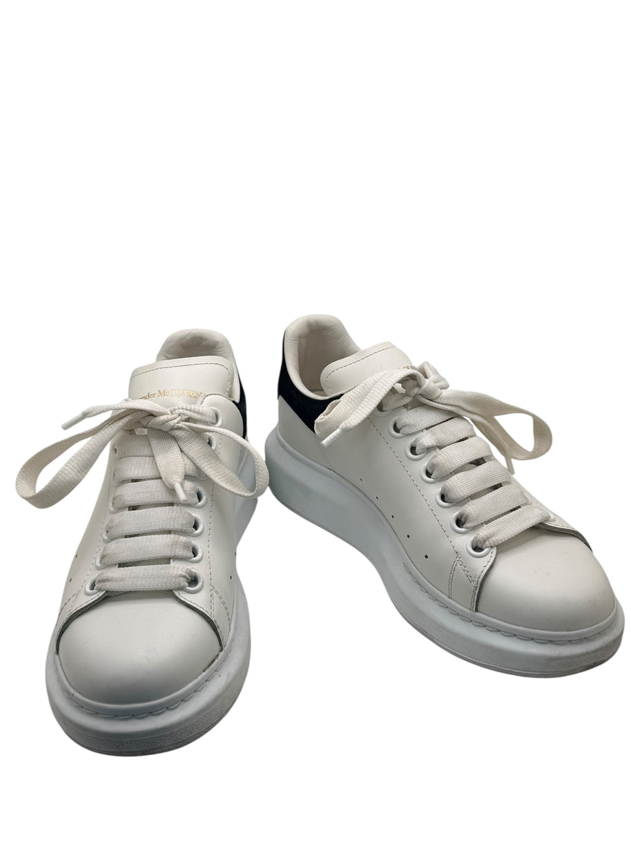 Alexander McQueen white leather oversized sneakers front three-quarter view