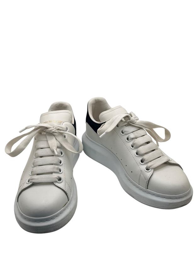 Alexander McQueen white leather oversized sneakers front three-quarter view