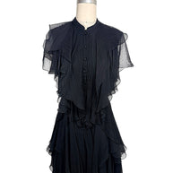 Alexander McQueen Pre-Fall 2016 black silk chiffon dress featuring pleated construction, cascading ruffles, sheer flutter sleeves, and an asymmetrical layered hem, front full view.