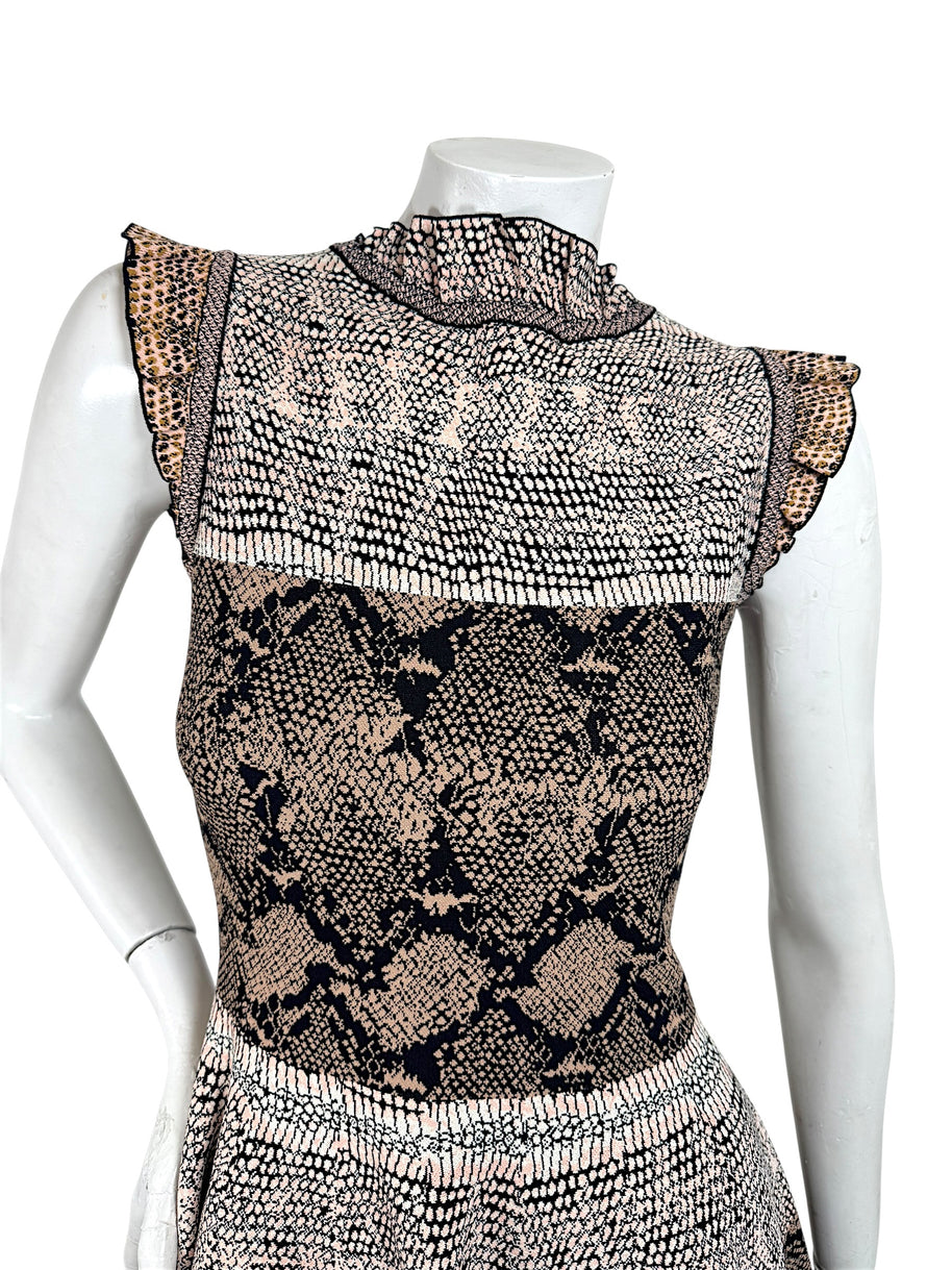 Close up detail of Alexander McQueen snakeskin jacquard knit dress bodice and ruffle trim