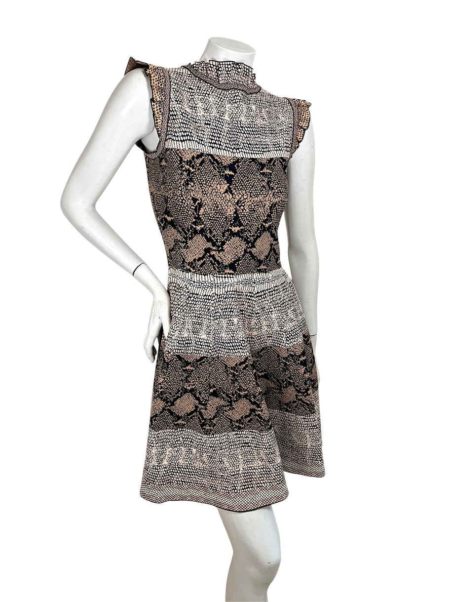 Back angled view of Alexander McQueen python jacquard knit dress in blush black and ivory tones