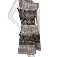 Back angled view of Alexander McQueen python jacquard knit dress in blush black and ivory tones