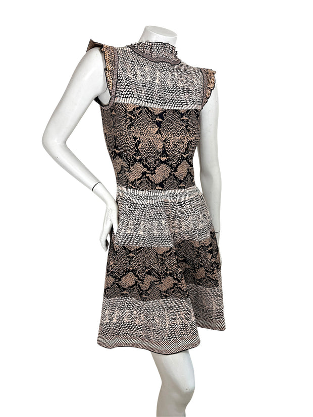 Back angled view of Alexander McQueen python jacquard knit dress in blush black and ivory tones