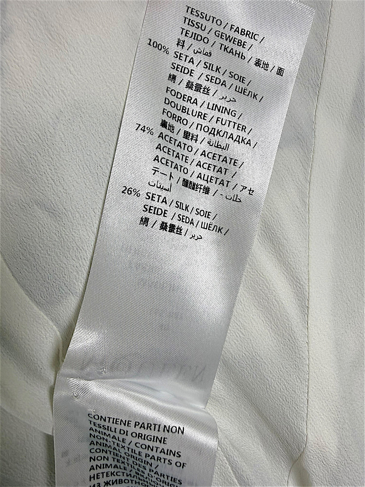 Alexander McQueen Resort 2019 seashell print dress composition label showing 100% silk exterior and acetate silk lining