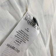 Alexander McQueen Resort 2019 seashell print silk dress interior label showing IT size 40 and Made in Italy