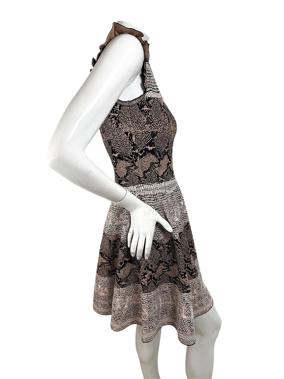 Right side view of Alexander McQueen knit dress featuring ruffle neckline and flared skirt