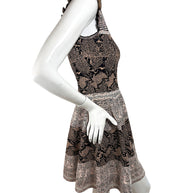 Right side view of Alexander McQueen knit dress featuring ruffle neckline and flared skirt