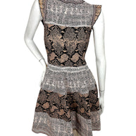 Alexander McQueen snakeskin jacquard knit dress front view with ruffle neckline and fit flare silhouette