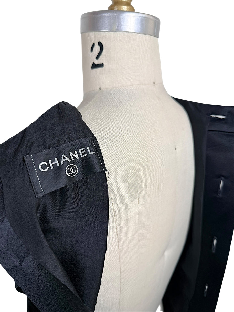 Interior Chanel label detail from authentic vintage black satin pleated dress made in France.