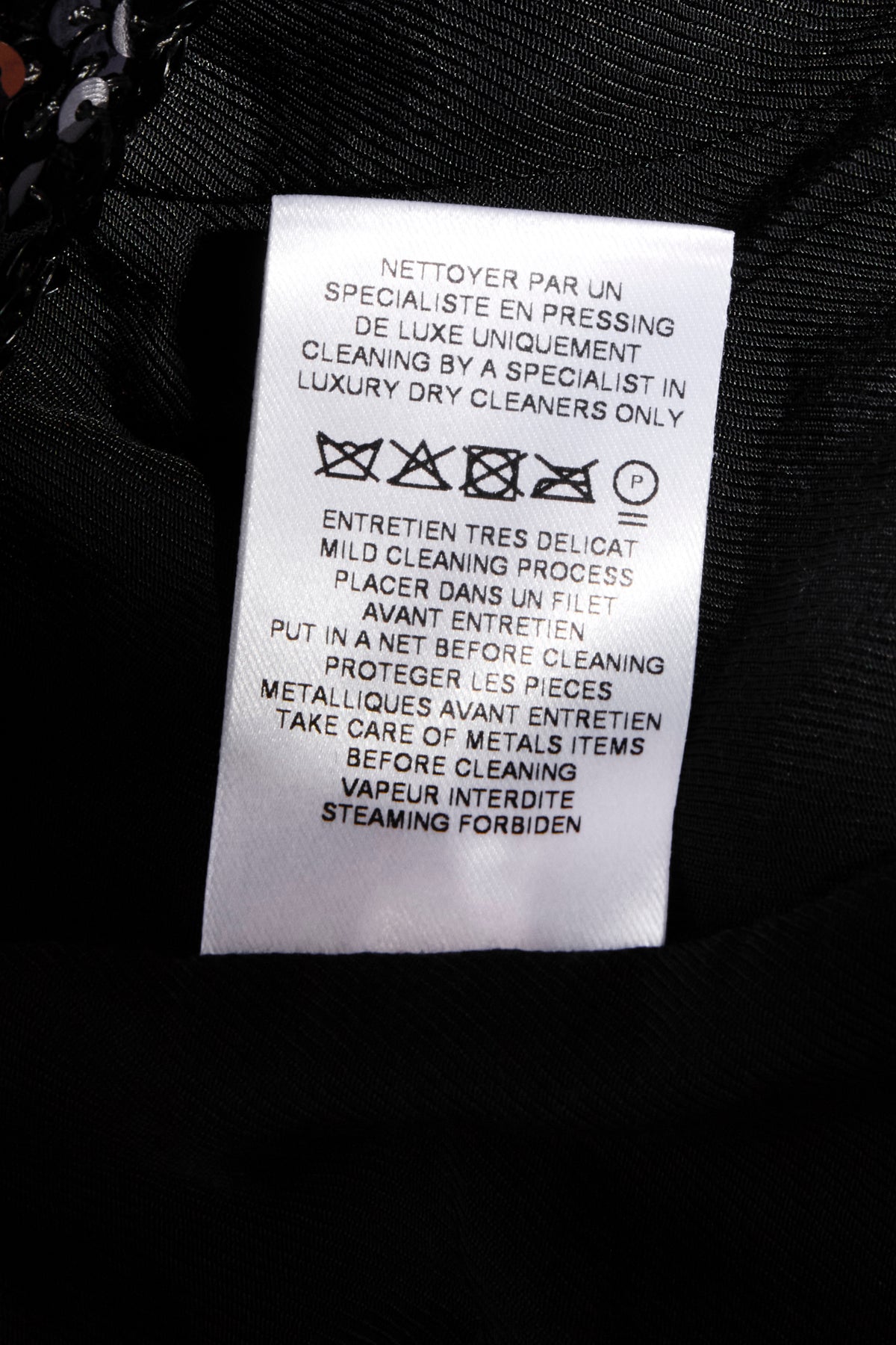 Balmain black sequin blazer interior care label with specialist dry cleaning instructions