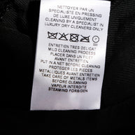 Balmain black sequin blazer interior care label with specialist dry cleaning instructions