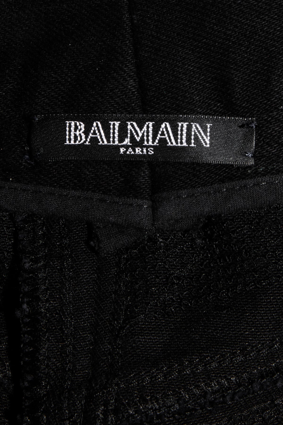 Balmain Paris label inside black sequin pants