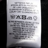 Balmain black sequin pants interior care label with sequin cleaning and care instructions