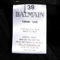 Balmain black sequin pants FR 38 composition label showing cotton and elastane fabric