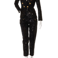 Balmain black sequin pantsuit with double-breasted blazer and gold-tone buttons, front view