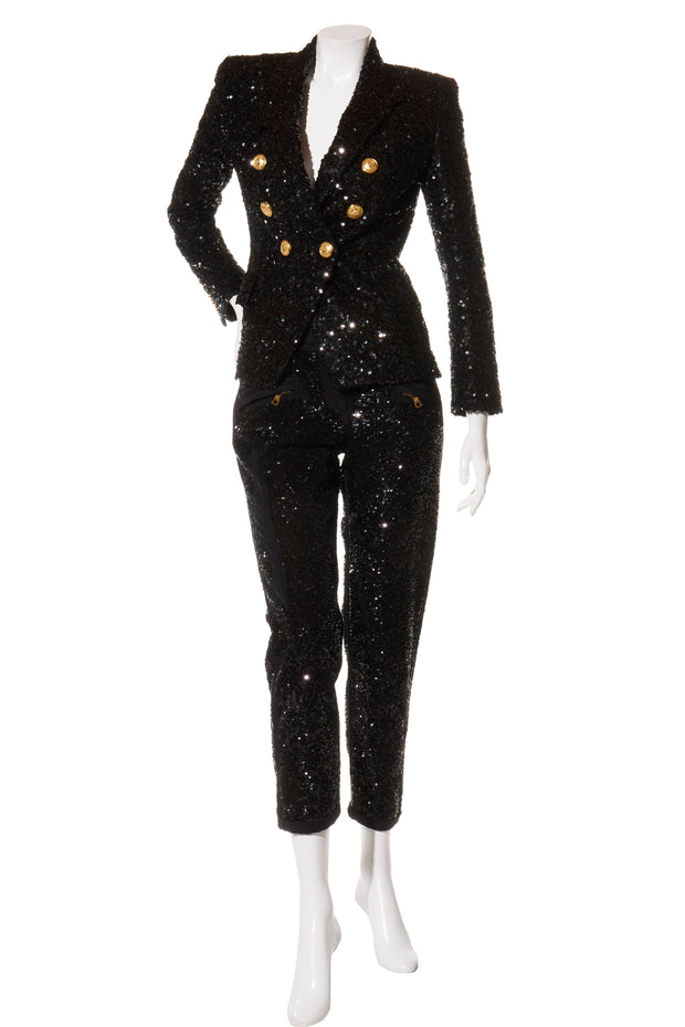 Balmain black sequin pantsuit with double-breasted blazer and gold-tone buttons, front view