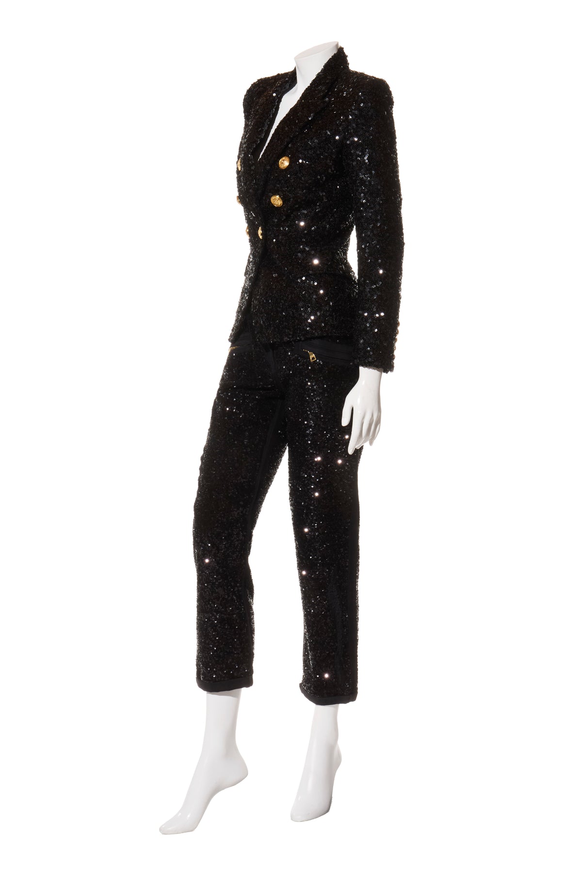 Balmain black sequin pantsuit with signature gold-tone buttons, three-quarter side view