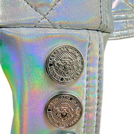 Close-up detail of embossed Balmain Paris crest buttons on the holographic silver cuff of the Fall 2018 runway jacket