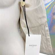 Interior of Balmain Fall 2018 holographic silver jacket showing original Balmain Paris retail hang tag