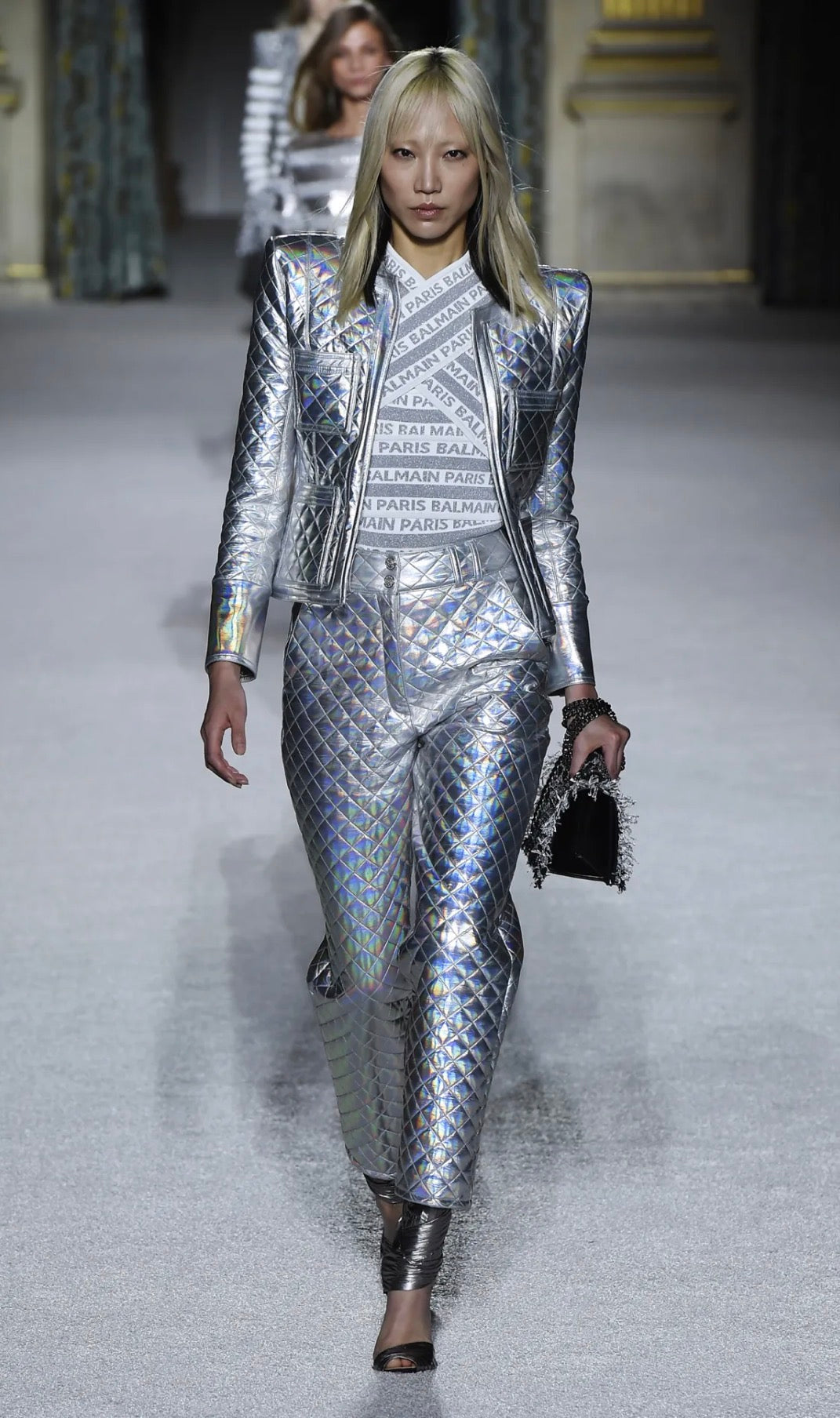 Balmain Fall Winter 2018 Look 8 runway presentation featuring the holographic silver quilted jacket with coordinating trousers